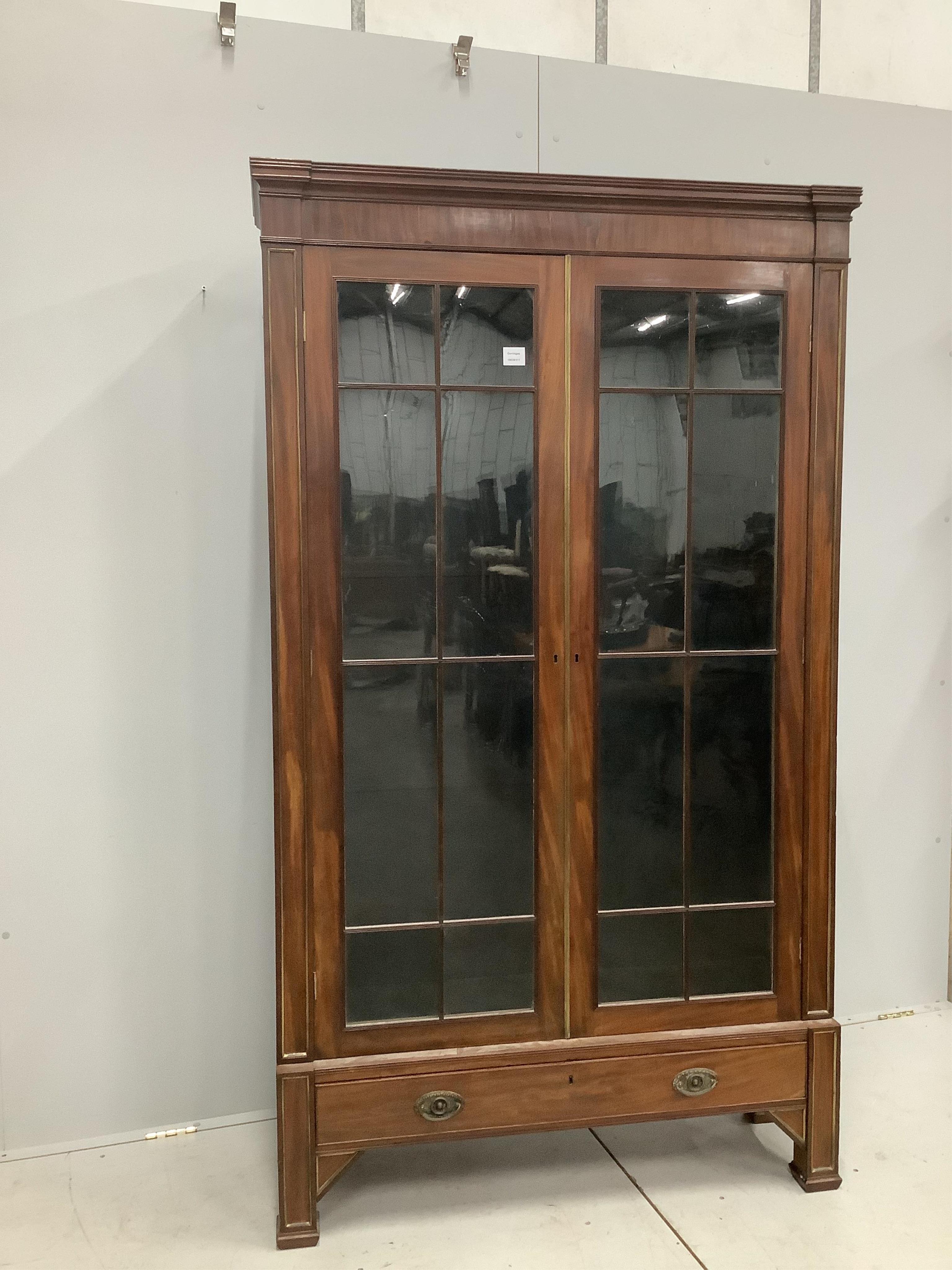 A 19th century French brass mounted mahogany bookcase, width 112cm, depth 32cm, height 195cm. Condition - fair